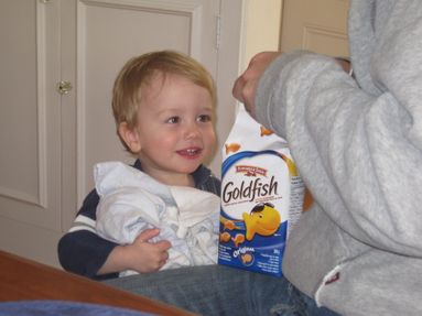 Brayden, one of our littlest Goldfish fans, happily enjoys a snack!