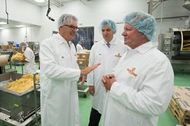 Officials from South Coast Baking and City National tour the Irvine facility at 1722 Kettering Street and look at some of the new equipment the bank financed.